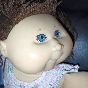 Adorable Doll with Blue Eyes and Brown Hair